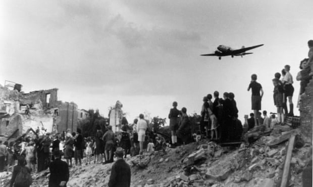 Berlin citizens watching the landing of an airlift aeroplane at Tempelhof airport during the blockade. 
