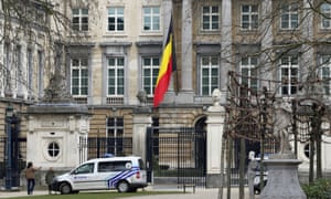 The Belgian flag hanging half mast at the Palais de la Nation, near the Maelbeek metro station in Brussels