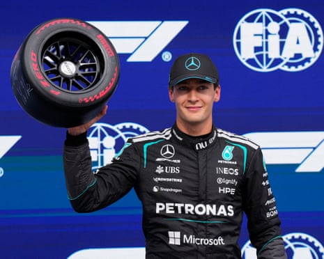 George Russell with his pole position trophy