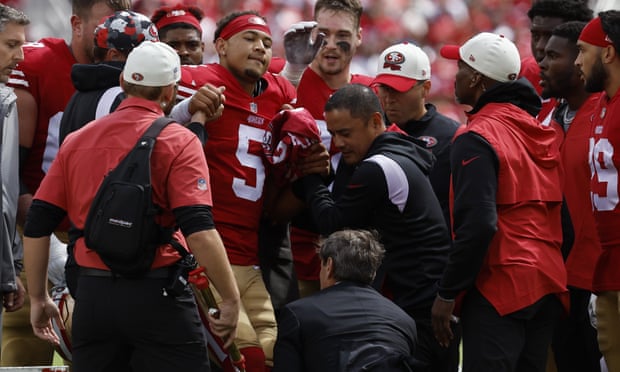 Trey Lance helped get on the cart after suffering a season-ending injury