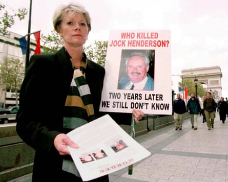Henderson appeals for information in 1999 at the spot where her husband was attacked in Paris.