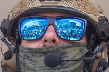 close up of a masked federal agent