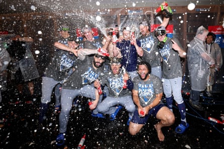 The Los Angeles Dodgers celebrate after defeating the Atlanta Braves in Game 4 of their National League Division Series at Truist Park in Atlanta on Wednesday.