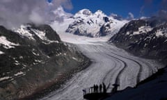 People enjoy the view at the Aletsch Glacier near Goms, Switzerland, Wednesday, June 14, 2023. (AP Photo/Matthias Schrader)