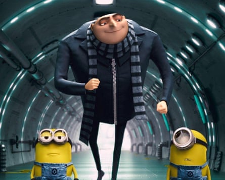 Gru, a character from the animated film Minions, walks along a tunnel with two yelllow creatures called minions at his feet.