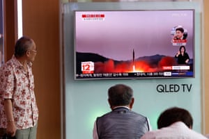 South Koreans watch a television displaying news broadcasts reporting on North Korea at a station in Seoul today.