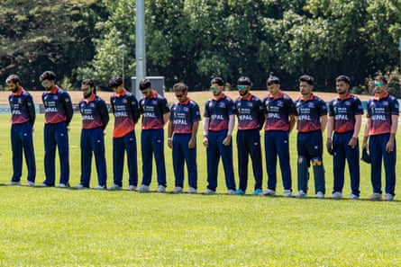 The Nepali T20 cricket team hold a minute of silence at the start of their game against the Hyderbad Kingsmen Academy in Darwin