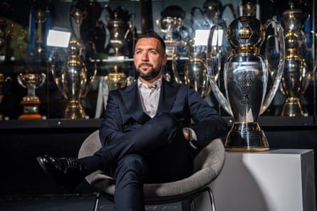 Francesco Farioli in front of a trophy cabinet at Porto
