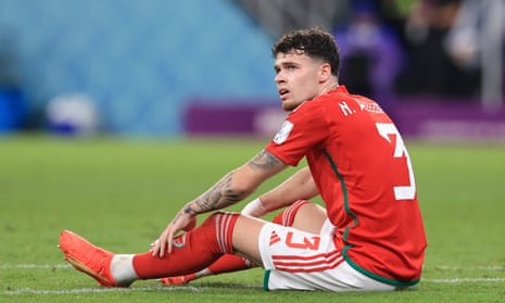 Neco Williams of Wales looks dejected before coming off the pitch.