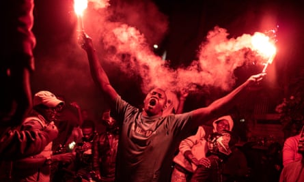 A supporter of Sonko and Faye celebrating after they were released from prison in March.