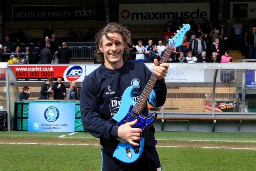 Ainsworth after being presented with a Wycombe Wanderers-themed guitar on 27 April 2013.