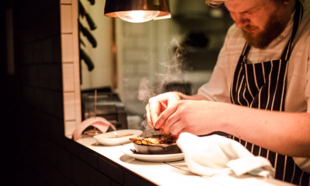 A chef adds the finishing touch to a dish at Maray, Liverpool, which is powered by green energy.