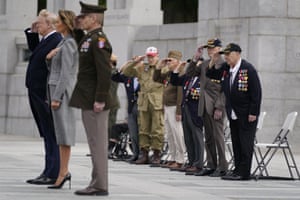 Veterans look on as Donald Trump and first lady Melania Trump participate in a wreath laying ceremony at the World War II Memorial to commemorate the 75th anniversary of Victory in Europe Day.