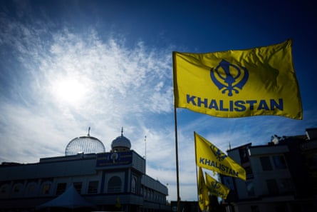 Khalistan flags are seen outside the Guru Nanak Sikh Gurdwara Sahib in Surrey, British Columbia where temple president Hardeep Singh Nijjar was gunned down in June.