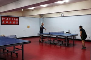 Men play ping pong