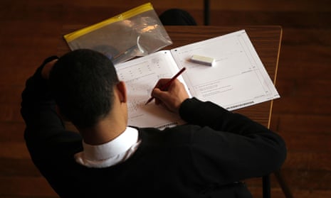 a young student sits a maths exam