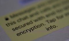 An encryption message is seen on the WhatsApp application on an iPhone