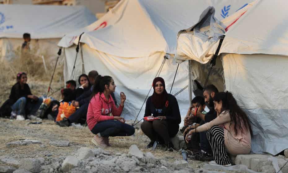 Syrian people who were displaced by a Turkish military operation are seen in 2019.