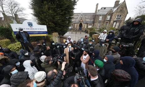 Protesters and the press outside Batley grammar school, West Yorkshire, on Friday