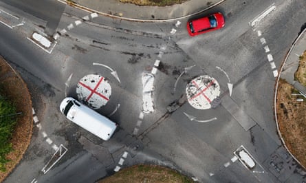 St George’s crosses painted over two mini roundabouts near Taplow, Berkshire.