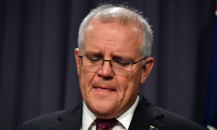 An emotional Scott Morrison holds back tears at the press conference.