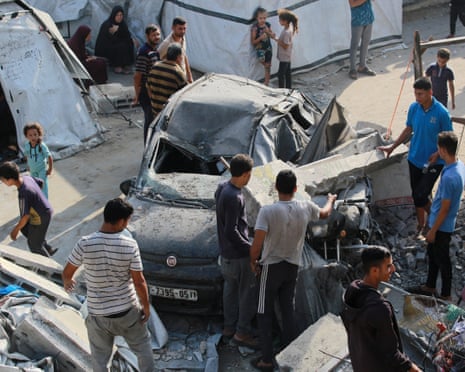 Palestinians inspect the damage at the site of an overnight Israeli strike on the Halima Saadiya school in Jabalia in the northern Gaza Strip on July 11, 2025.