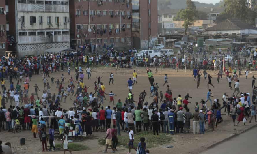 A crowd watches an informal football match in a Harare township. The pandemic hit before professional clubs could begin the new season in 2020.