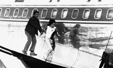 A bloodstained Theresa Halsa leaves the plane on 9 May 1972