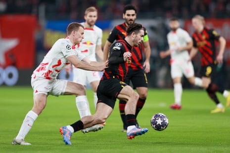 Jack Grealish is put under pressure by Lukas Klostermann.