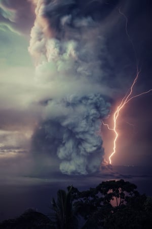 Billows of smoke with lightning from the eruption of the volcanic island