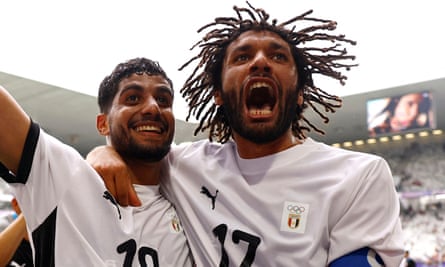 Egypt’s Ibrahim Adel and Mohamed Elneny celebrate victory over Spain.