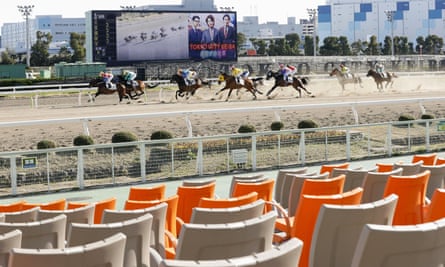A race meeting is held without spectators at Oi course in Tokyo in February.