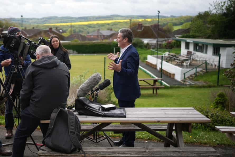 Keir Starmer speaks to the media while campaigning at Horbury working members club, Cluntergate, in Wakefield.