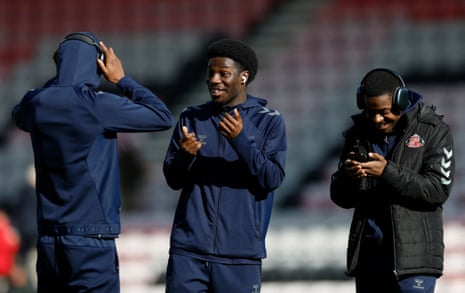 Eliezer Mayenda (centre) holds court on the pitch at the Vitality Stadium ahead of kick-off.