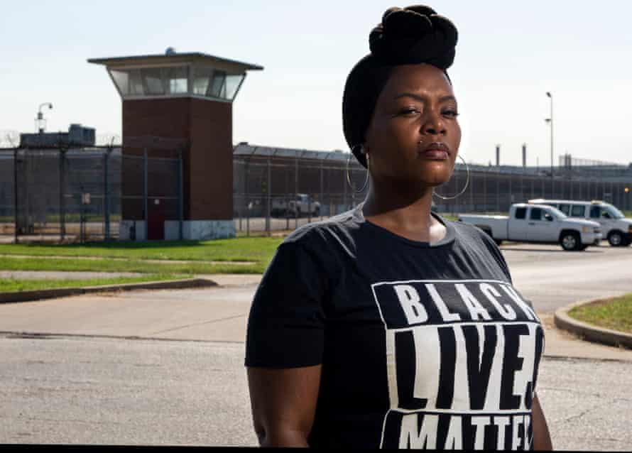 Inez Bordeaux, an organizer in the Close the Workhouse campaign, poses in front of the Workhouse in 2018.