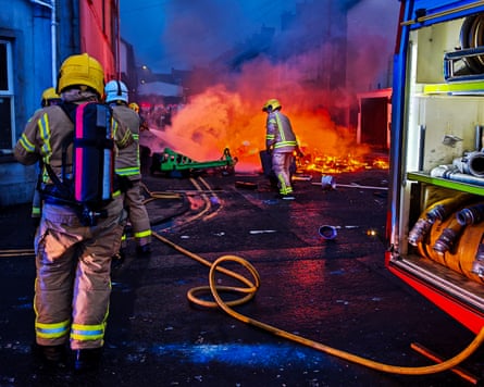 Firefighters tackle a blaze in a residential area