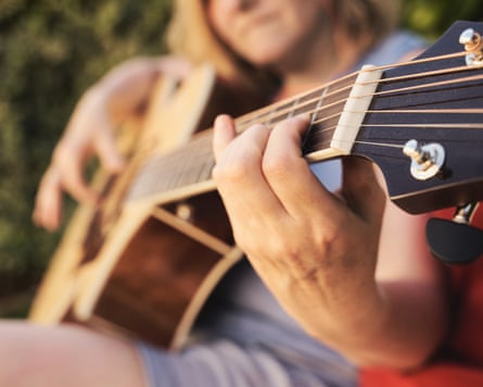 A person playing a guitar
