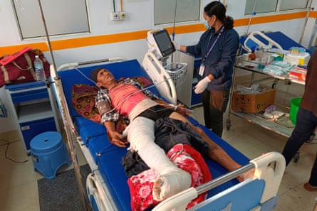 A doctor looks after a patient injured in an earthquake, evacuated from his village and brought to a hospital in Nepalgunj, Nepal.