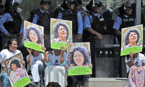 Human rights activists take part in a protest to claim justice for Berta Caceres