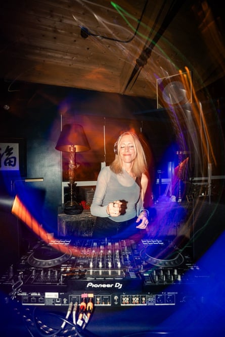 She dances behind the decks, eyes closed, smiling