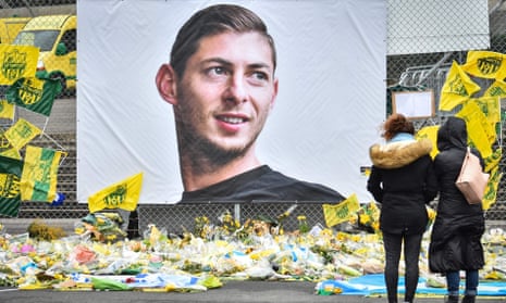 People look at floral tributes to Argentinian footballer Emiliano Sala at the Beaujoire stadium in Nantes