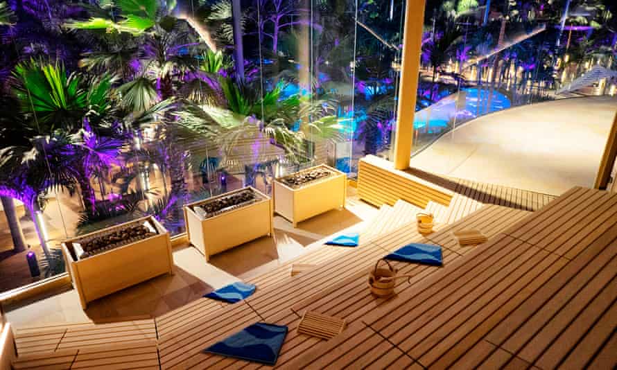 sauna with huge picture windows over pool