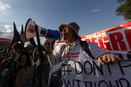 Relatives of victims of forced disappearance protest outside Azteca Stadium.