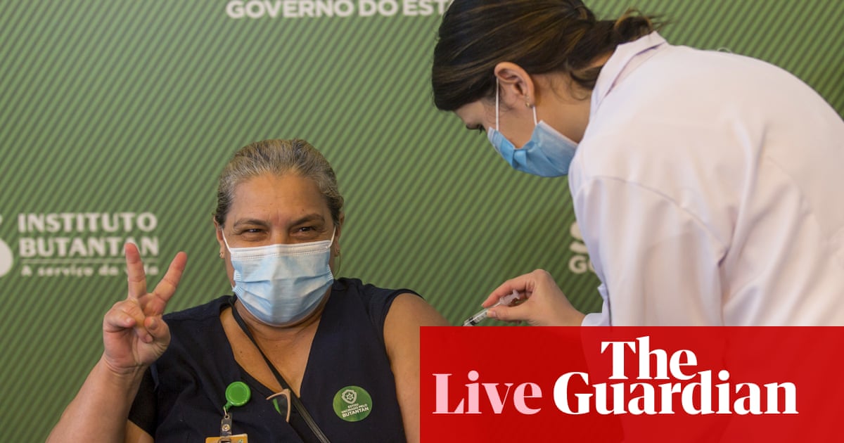 Coronavirus live news: Brazil approves two Covid vaccines for emergency use as US nears 400,000 deaths
