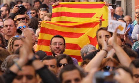 Protesters in Madrid carry Catalan separatist flags during a rally in favour of a planned referendum on independence.