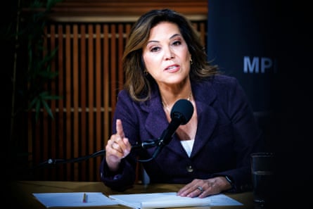 a woman in front of a microphone