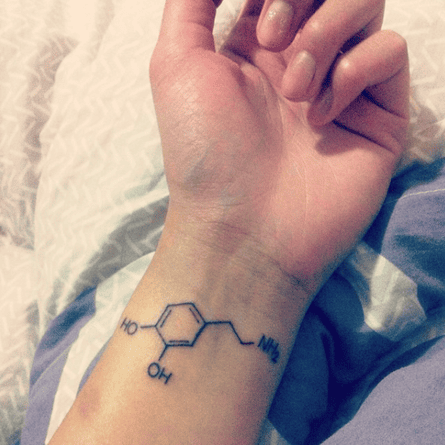 A tattoo of a molecular diagram of dopamine
