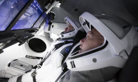Doug Hurley, foreground, and Bob Behnken work in SpaceX’s flight simulator at the Kennedy Space Center in Cape Canaveral, Florida.