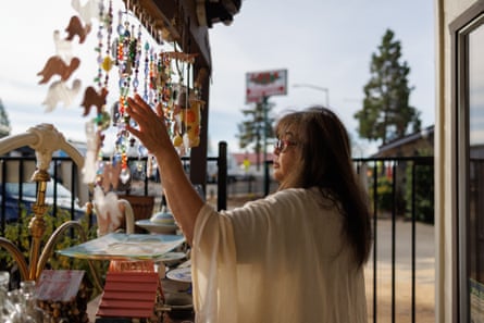 Iris Natividad stands outside her art store in Paradise, California.