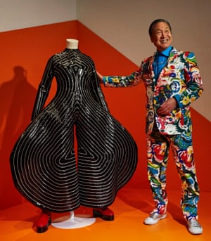 Kansai Yamamoto, with the ‘Tokyo Pop’ jumpsuit he designed for David Bowie, at a Bowie exhibition in Barcelona, 2017.